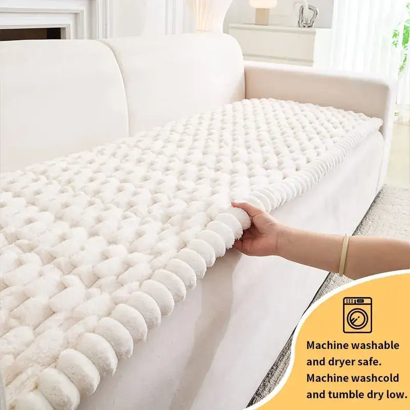 Plush white textured knitted sofa cover with raised pattern and anti slip feature for living room protection