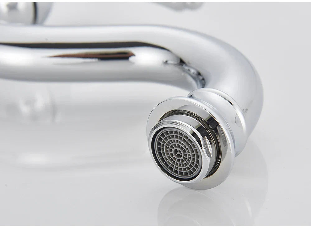 Chrome finished deck mounted single hole kitchen faucet with sleek curved spout and circular spray head with concentric ridges