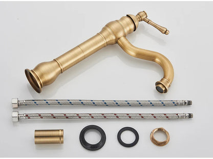 Antique brass deck mounted single hole bathroom faucet with elongated spout and ridged housing material design