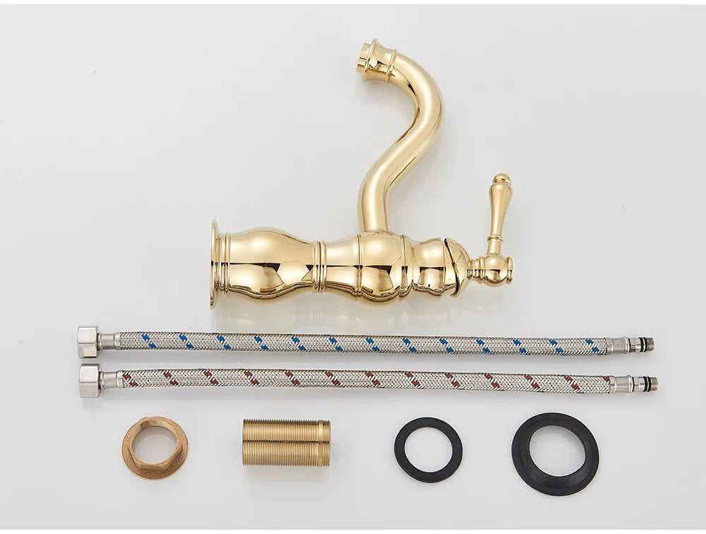 Gold-finished antique brass single hole deck mounted vintage-style kitchen faucet with ornate detailing and single lever handle