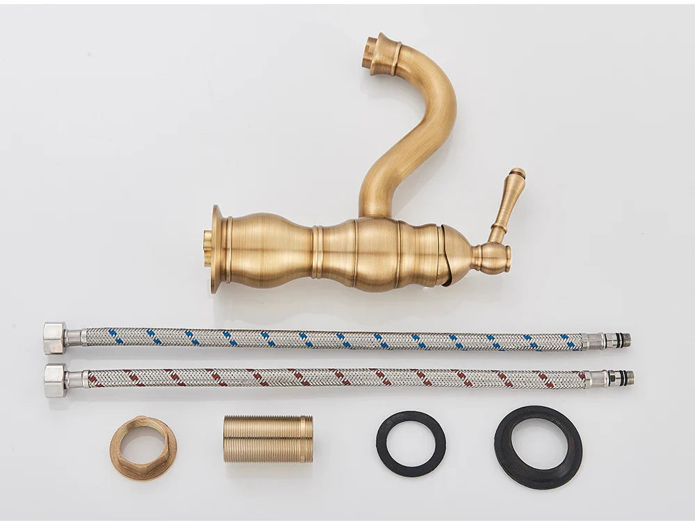 Antique brass deck mounted single hole basin vessel sink faucet with curved spout ornate handle and flexible braided hoses