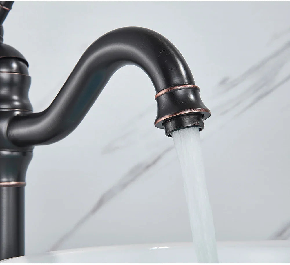 Poiqihy antique brass single hole deck mounted bathroom faucet with bronze finish, curved spout, and copper-toned accents
