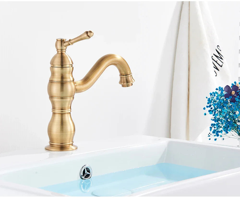 Poiqihy antique brass single hole deck mounted bathroom faucet with curved spout and ridged brass housing material