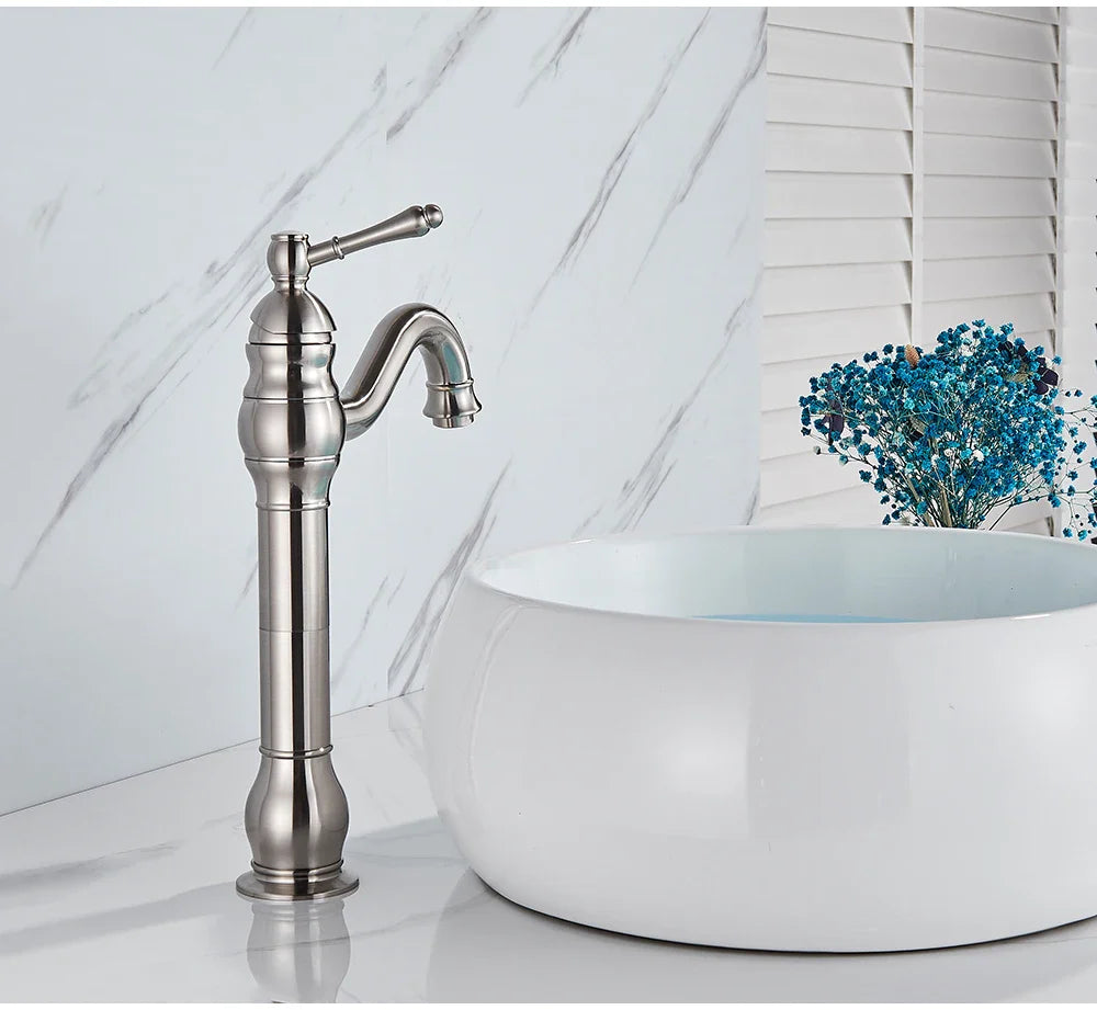 Stylish brushed nickel single hole deck mounted basin faucet with curved spout and decorative ridged base housing material