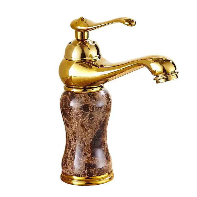Polished brass bathroom sink faucet with gold-finished spout and handle mounted on decorbites golden marble base