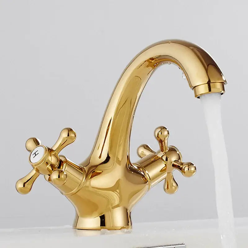 Polished brass dual cross handle bathroom bidet faucet with gold-colored curved spout and dual cross handles