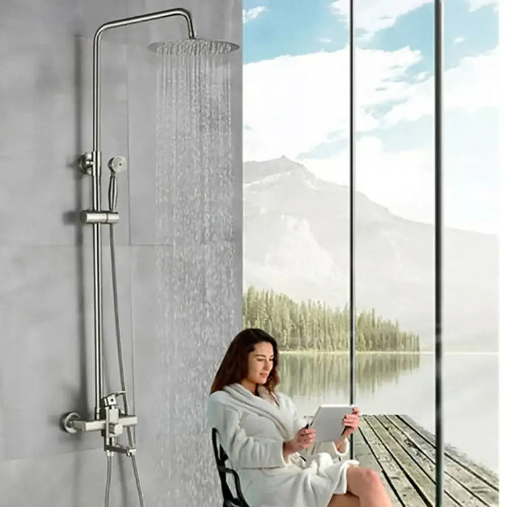Modern brushed stainless steel shower faucet set with tall rainhead and handheld nozzle for bathroom use