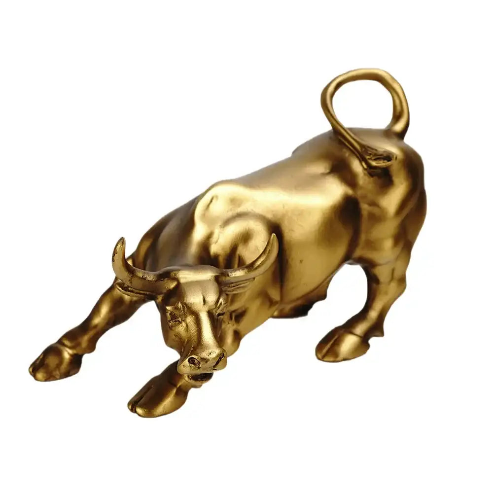Polished gold wall street bull statue with looped tail in dynamic charging pose for decorbites gold wall office decor