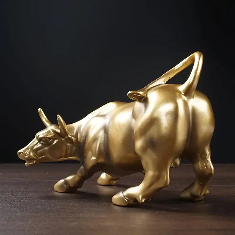 Polished gold wall street bull statue with detailed musculature and raised tail for decorbites gold wall office decor