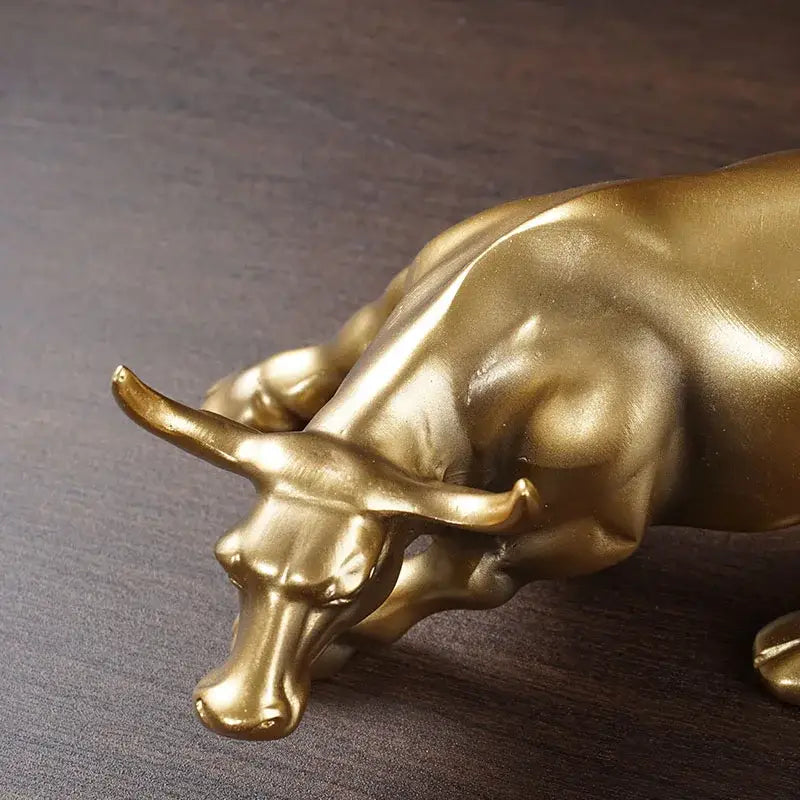 Polished gold wall street bull statue with detailed musculature and curved horns for decorbites gold wall office decor