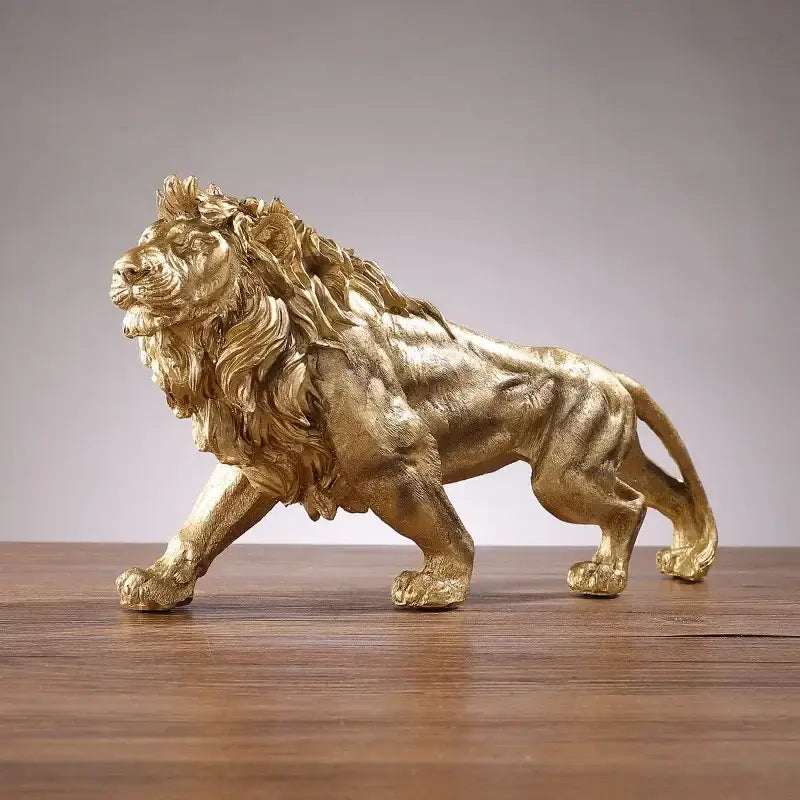 Polished golden lion king resin statue with muscular physique and detailed mane in metallic finish for home decorbites decor