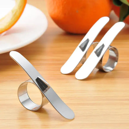 Polished stainless steel citrus peeler ring with shiny curved blade and metallic finish by decorbites citrus peeler