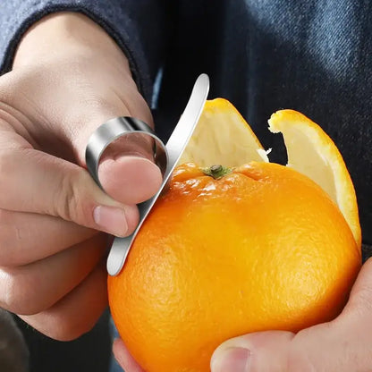 Silver finger citrus peeler with sleek curved blade and polished stainless steel finish by decorbites citrus peeler