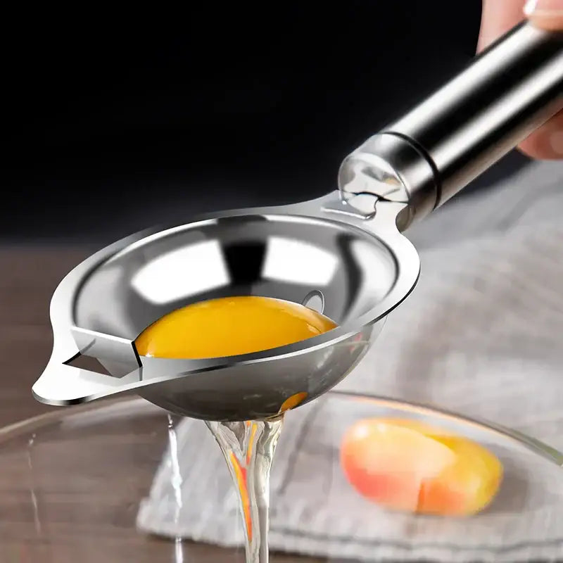 Polished stainless steel egg white separator with sleek finish and ergonomic handle for efficient egg white separation