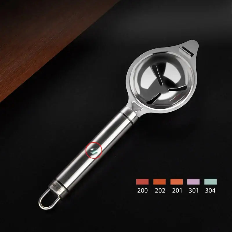 Polished stainless steel egg white separator with sleek finish and three slotted openings for separating egg white