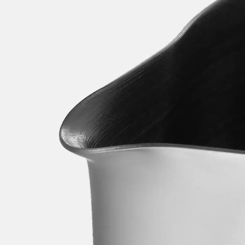 Black wooden lid with smooth curved edge and subtle grain texture for decorbites frothing cup stainless steel pitcher