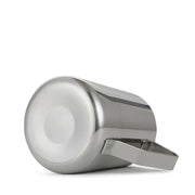 A polished stainless steel frothing cup with integrated handle for latte art by decorbites frothing cup
