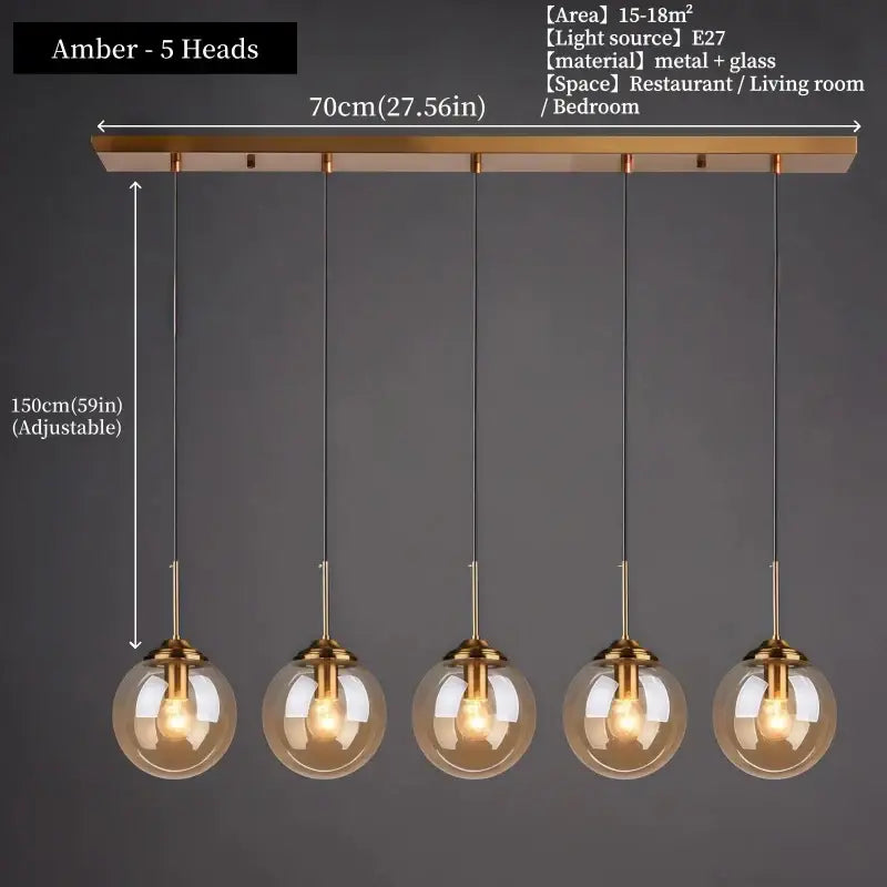 Modern amber glass pendant light with five spherical bulbs and brass fixtures in polished steel glass pendant light trio for dining room