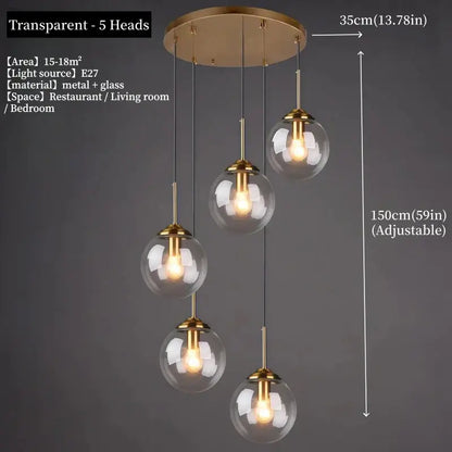Modern polished steel pendant light with brass finish and five clear glass globe shades for dining room use