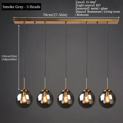Smoke gray polished steel pendant light with five glass globe shades and brass-finished bar for dining room use