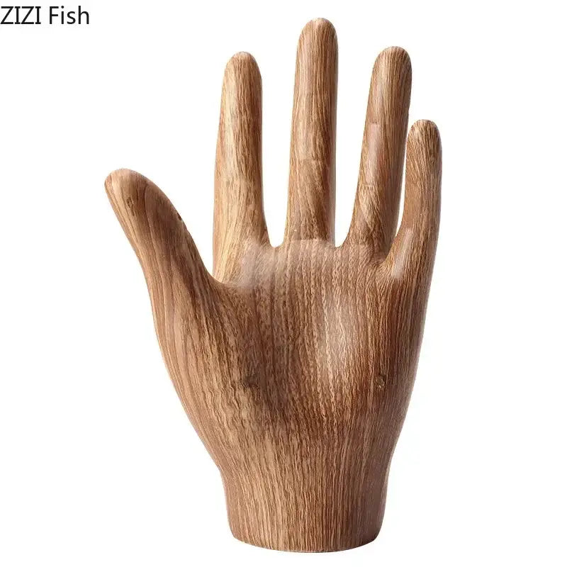 Polished wooden hand palm sculpture with natural wood grain finish and smooth contours for living room decor