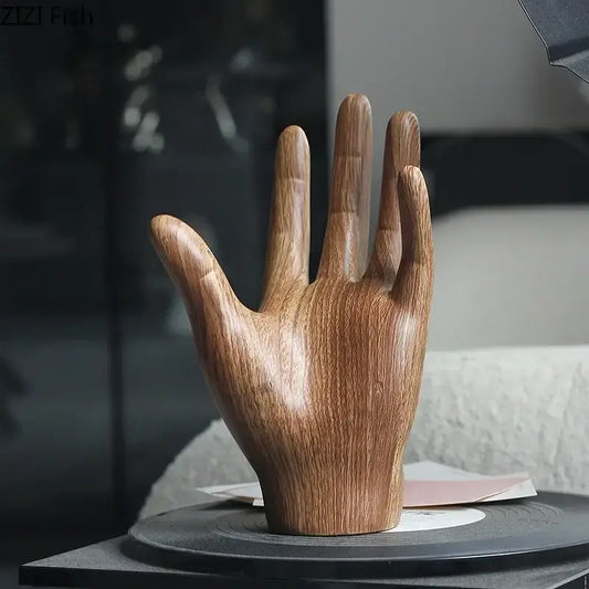 A polished wooden hand palm sculpture with natural wood grain finish for elegant living room decor