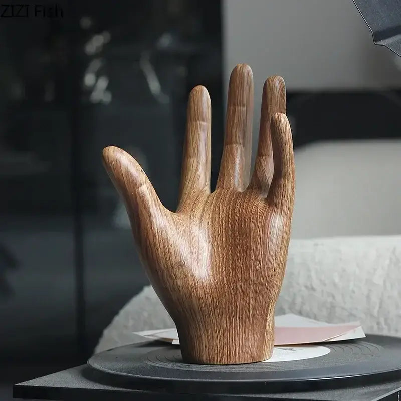 A polished wooden hand palm sculpture with natural wood grain finish for elegant living room decor