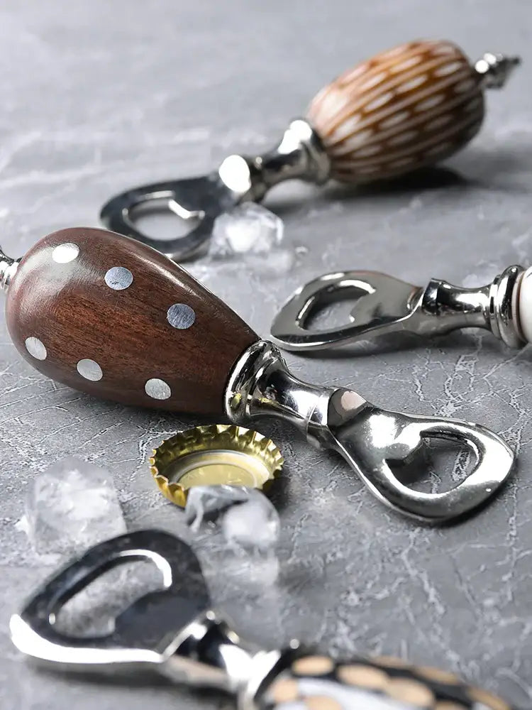 Polka dot black and white ceramic beer bottle opener with polished wooden handle and silver polka dots to enhance drinking experience