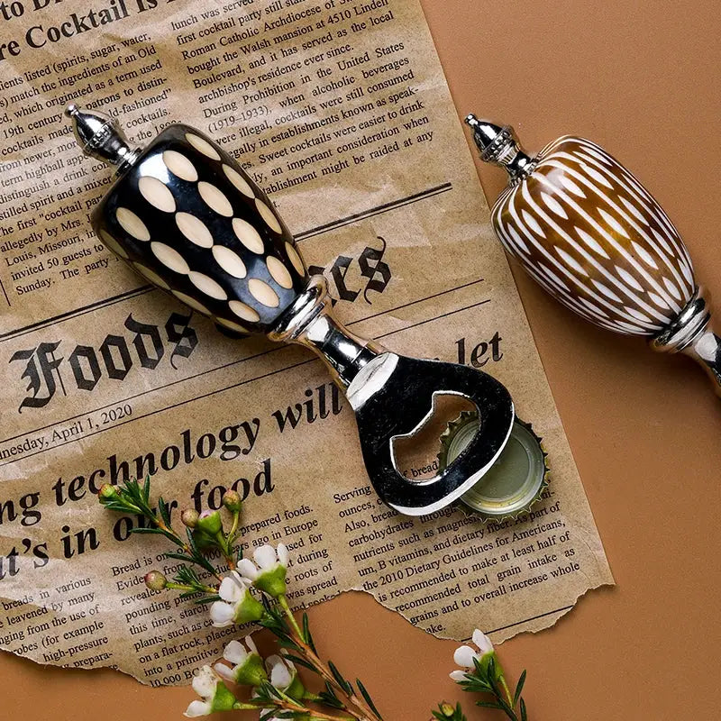 Black and cream polka-dotted ceramic beer bottle opener with silver metal accents for enhanced drinking experience