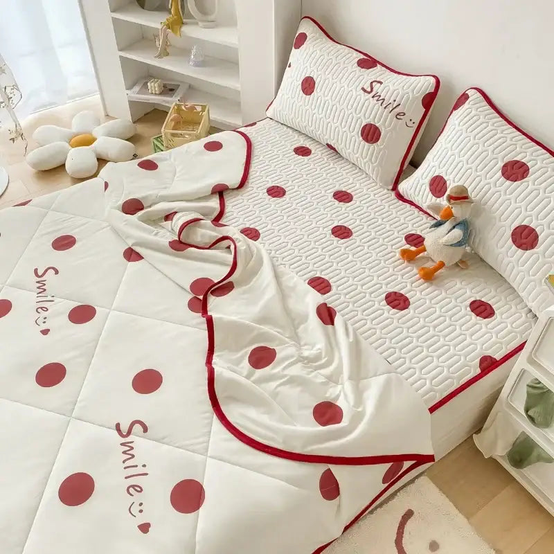 White quilted cool comforter set with red polka dots and embroidered smile text in soft cotton fabric finish