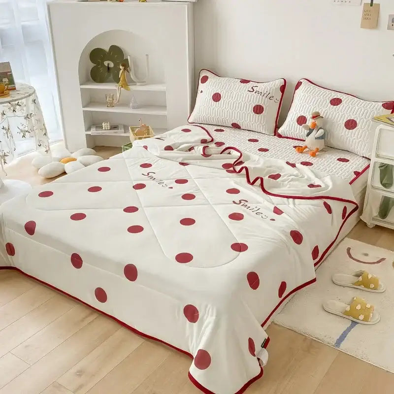 White quilted cool comforter set with red polka dots and embroidered smile text for bedroom bedding