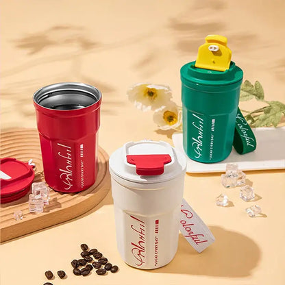 Red insulated 400ml coffee thermos bottle with silver rim and colorful script design for portable use