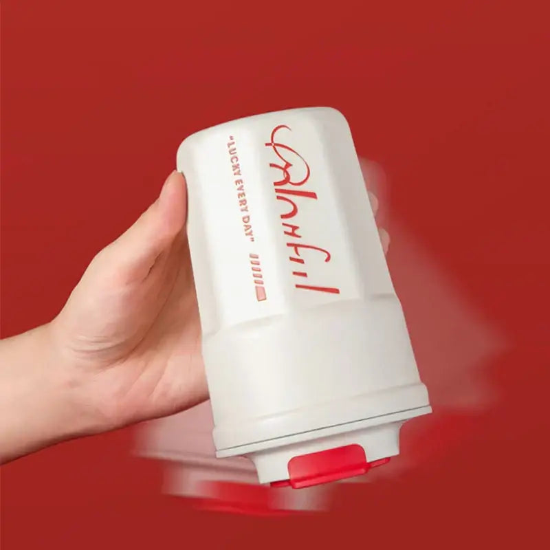 White cylindrical 400ml coffee thermos bottle with red cursive branding and matching red flip-top lid for travel use