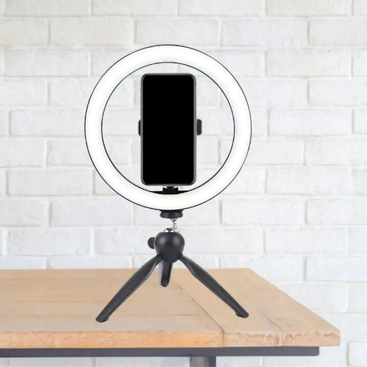 Portable black and white led ring light with phone mounted on compact tripod for 110v-120v and 220v-240v use
