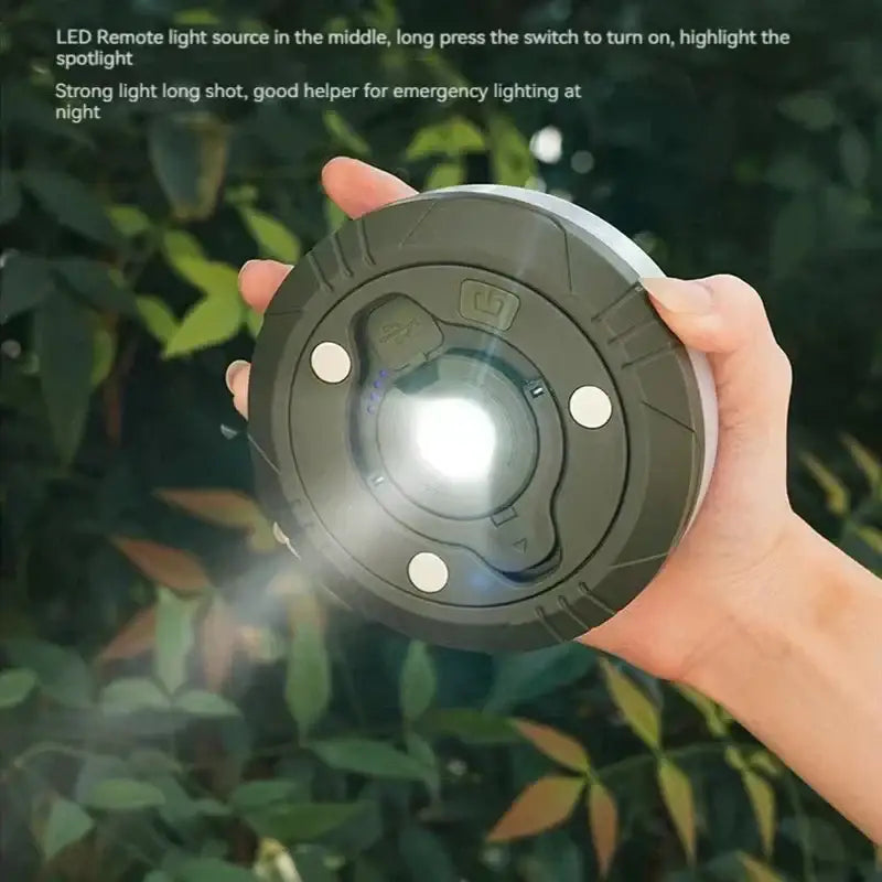 Portable black and silver circular led camping light strip remote with textured grip and button controls for tent decor