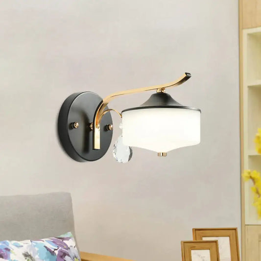 Post modern black and gold wall sconce with opal glass shade and crystal droplet for bedroom lighting