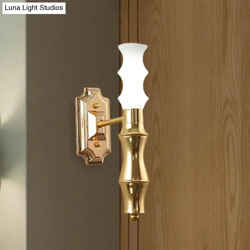 Post-modern brass bamboo wall sconce with gold finish, white fluted glass shade, ornate metal mount, and e27 bulb base