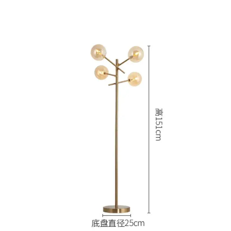A modern brass-finished floor lamp with five glass bubble ball bulbs in a decorbites glass bubble design for living room