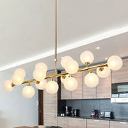DecorBites 16-light gold linear island chandelier post modern light fixture with frosted glass globe shades