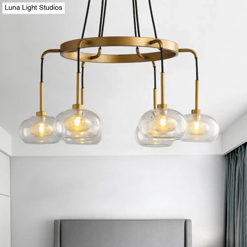 DecorBites™ post-modern island chandelier with clear glass globes, brass-toned finish, black cords, and five LED lights