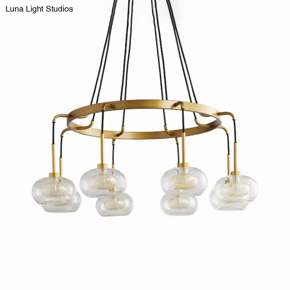 DecorBites™ post-modern island chandelier with gold finish, clear glass globes, five lights, and black cord suspension