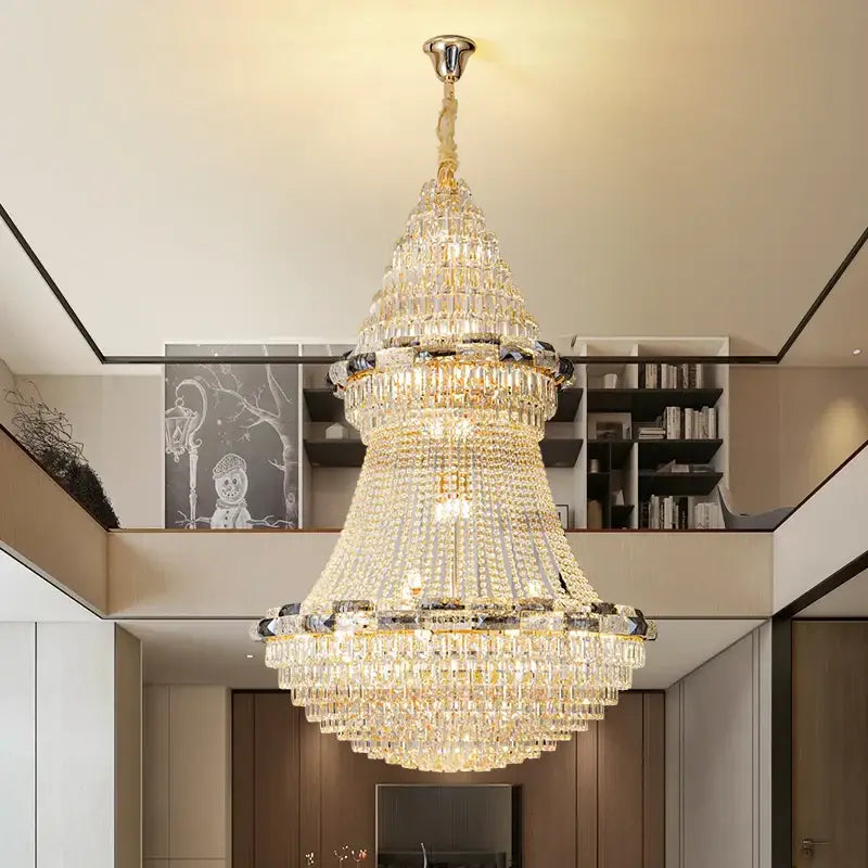 Post-modern luxury crystal chandelier with gold-toned frame and cascading clear crystals for light luxury decorbites light
