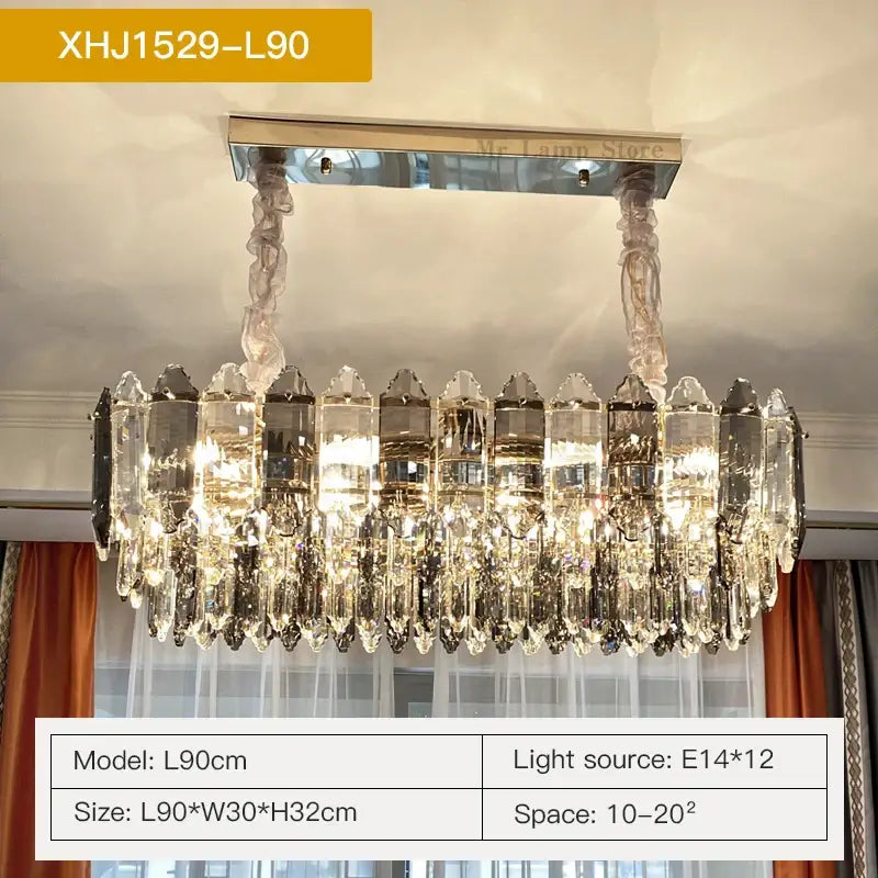 A modern decorbites crystal chandelier featuring clear faceted prisms with polished chrome and brass finish