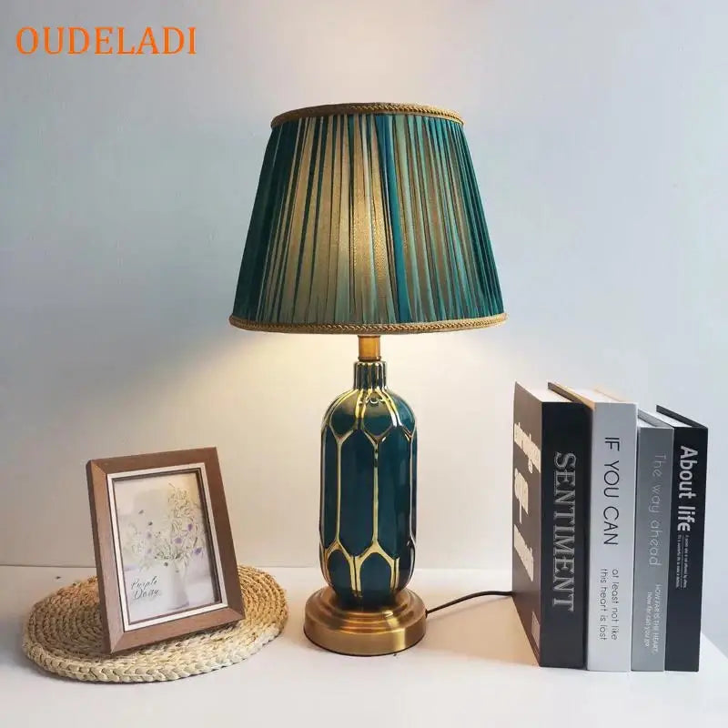 Post modern teal and gold ceramic table lamp with gold geometric accents and pleated green gold shade for bedroom lighting