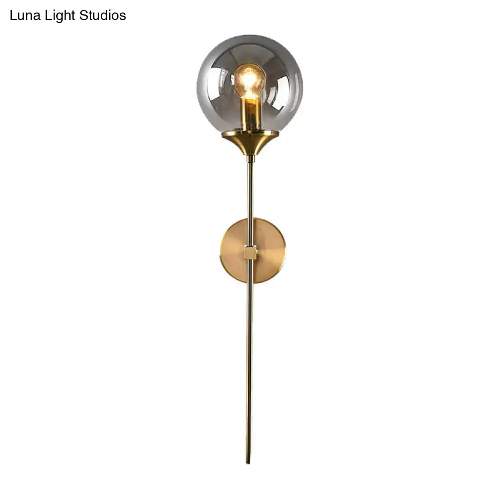Modern wall sconce with smoke grey glass globe and brass frame compatible with e26 e27 bulb for bedroom use