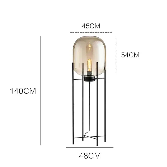 Postmodern black metal floor lamp with amber glass ball and frosted globe housing exposed filament bulb decorbites glass ball