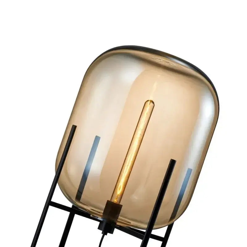 Postmodern floor lamp with amber glass ball dome and black metal frame ideal for living room decorbites glass ball design