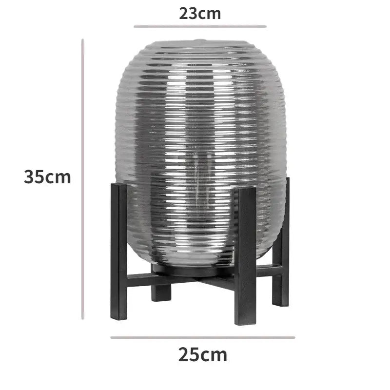 Postmodern amber glass ball floor lamp with ribbed glass ball and black metal frame by decorbites for living room decor