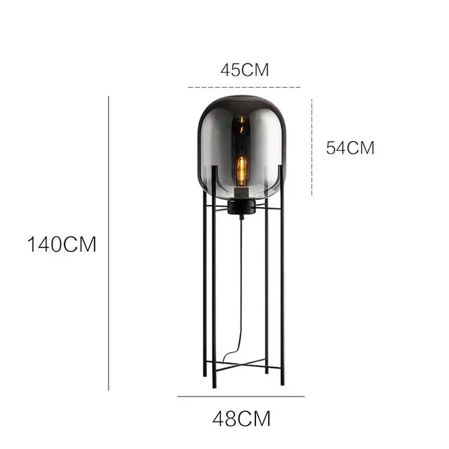 A sleek floor lamp with a dark smoked glass ball and black metal frame perfect for modern living room decorbites glass ball