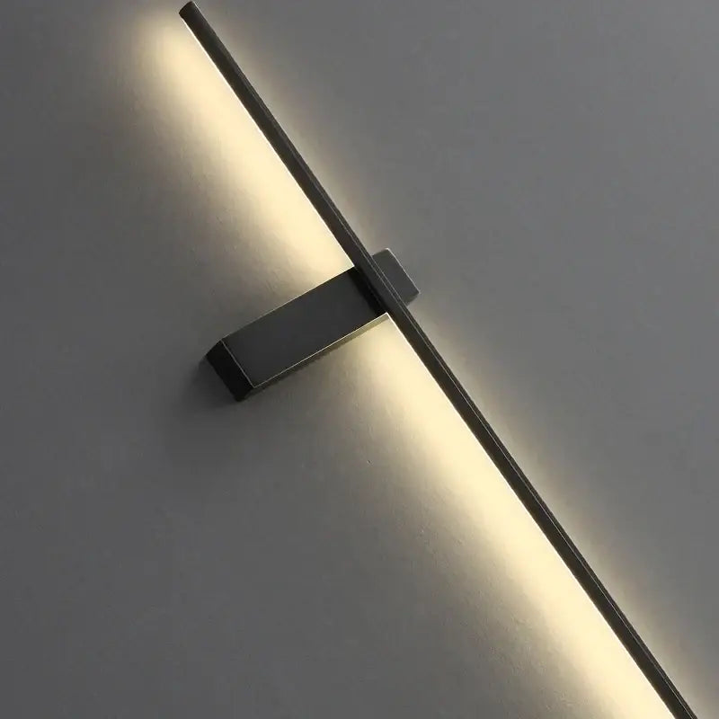 Postmodern black copper wall lamp with sleek linear design and warm ambient lighting for minimalist bedroom decorbites copper wall lamp